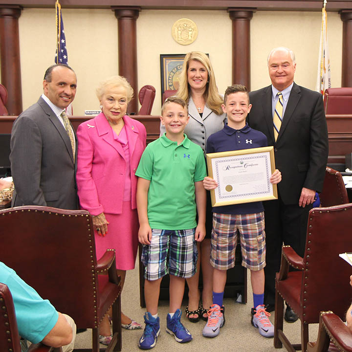 The Monmouth County Boarder of Chosen Freeholders applauded Joseph “Joey” Butler, 12, of Freehold for founding the non-profit organization “Wrestle in my Shoes” at their regular public meeting on June 11 in Freehold, NJ. Pictured left to right: Freeholder Thomas A. Arnone, Freeholder Lillian G. Burry, Jake Butler, Freeholder Deputy Director Serena DiMaso, Joey Butler and Freeholder John P. Curley. 