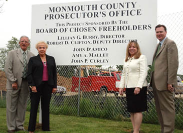 Monmouth County Freeholders stand in front of the new prosecutor's building construction site