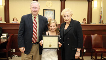 Allison Schecher, won a $100 bond for an essay she wrote about her ancestor who fought in the Civil War. Pictured with Allison are Historic Commission member Glenn Cashion and Freeholder Director Lillian G. Burry.