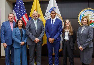 Commissioner Anderson, Commissioner Kiley, Prosecutor Santiago and those recently sworn in standing for a group photo